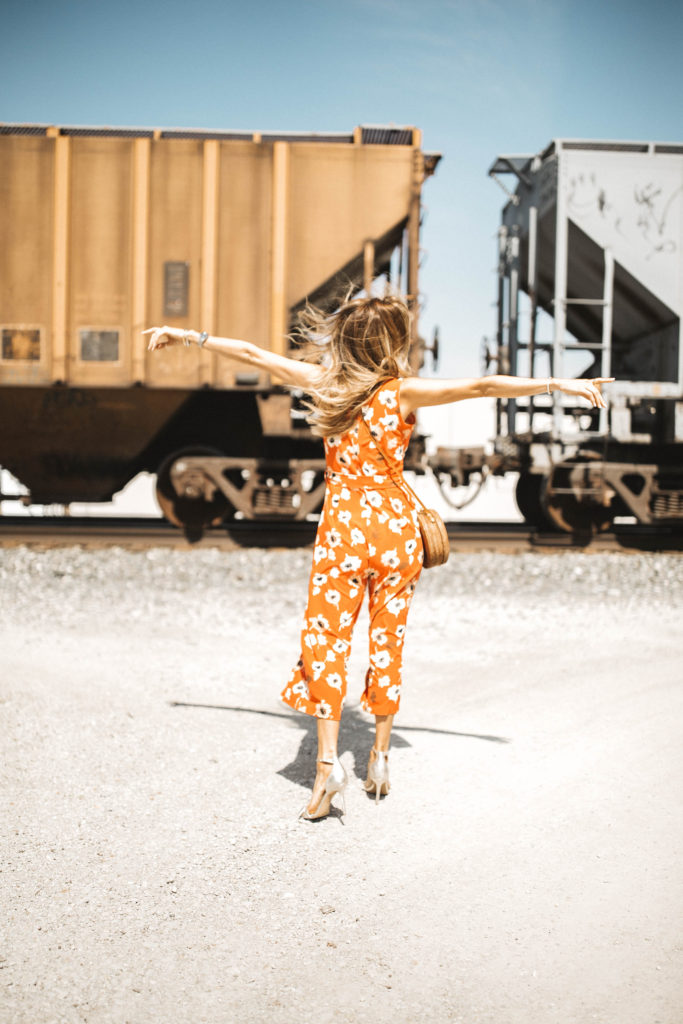 orange Floral jumpsuit shein and round basket bag - Cute Spring Styles Under $30 featured by popular Indianapolis fashion blogger, Karina Style Diaries