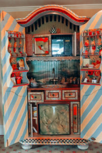 MacKenzie-Childs farmhouse kitchen in a cupboard