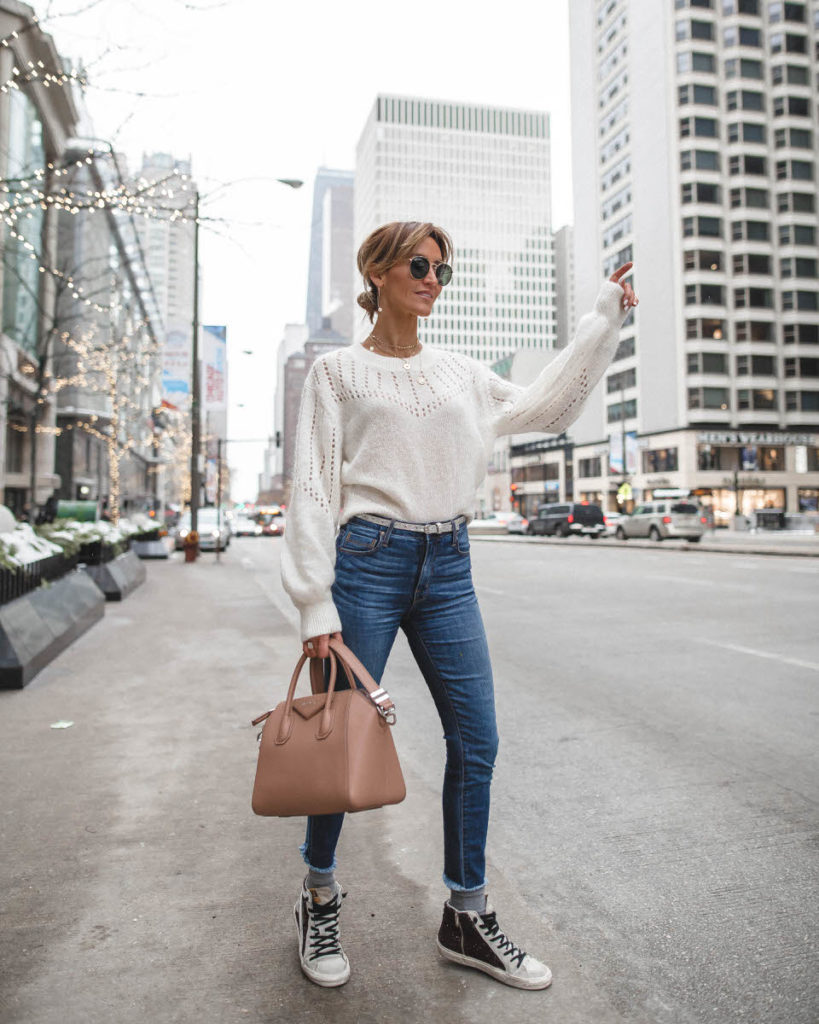 white sweatrer baloon sleeve | givenchy antigona pink | street style city Weekly outfit recap featured by top US fashion blogger, Karina Style Diaries: image of a woman wearing & other stories sweater, Evereve ankle skinny jeans, Golden Goose sneakers and Givenchy satchel