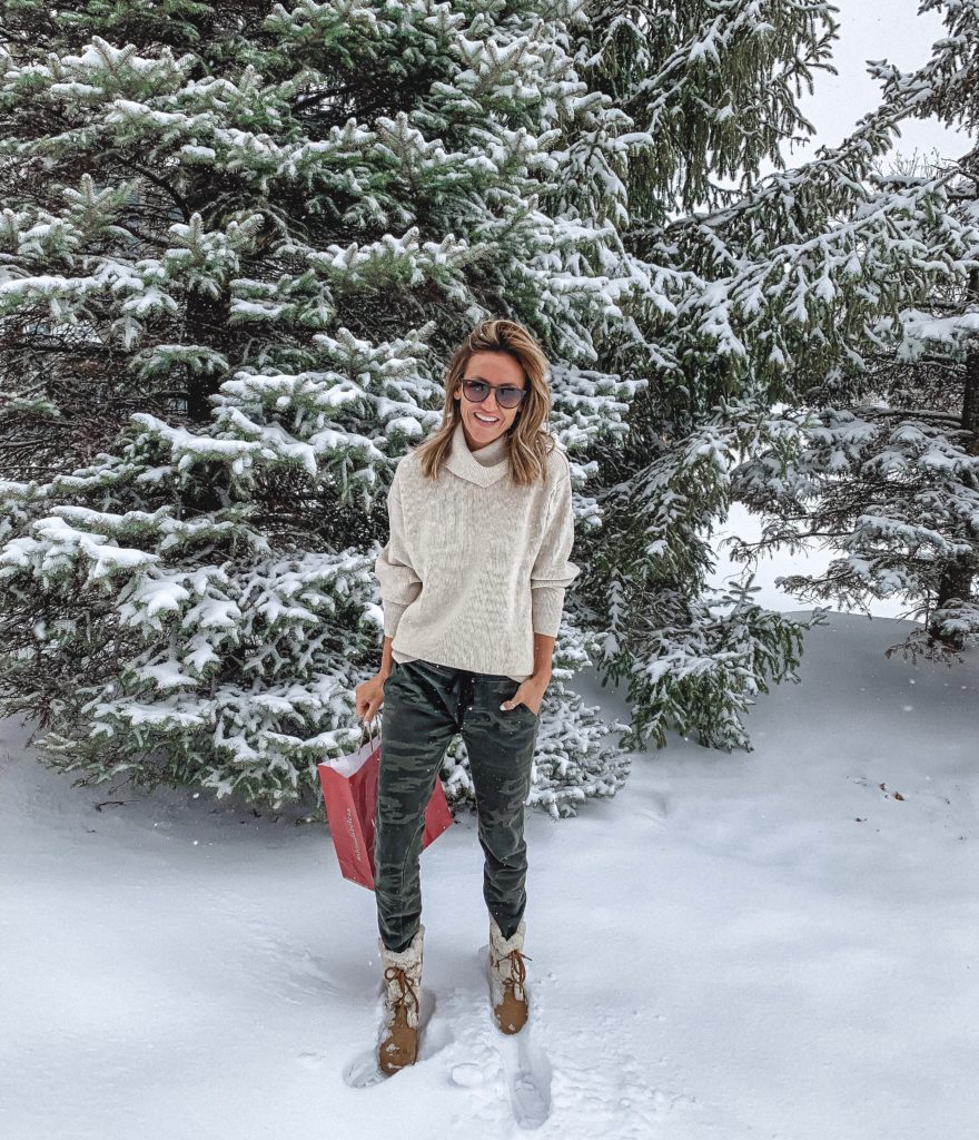 Free people softly tunic | Camo joggers | sorel sherpa booties | Weekly outfit recap featured by top US fashion blogger, Karina Style Diaries: image of a woman wearing Sanctuary camouflage jogger pants, Free People turtleneck, Zappos snow booties and Ray-ban classic sunglasses