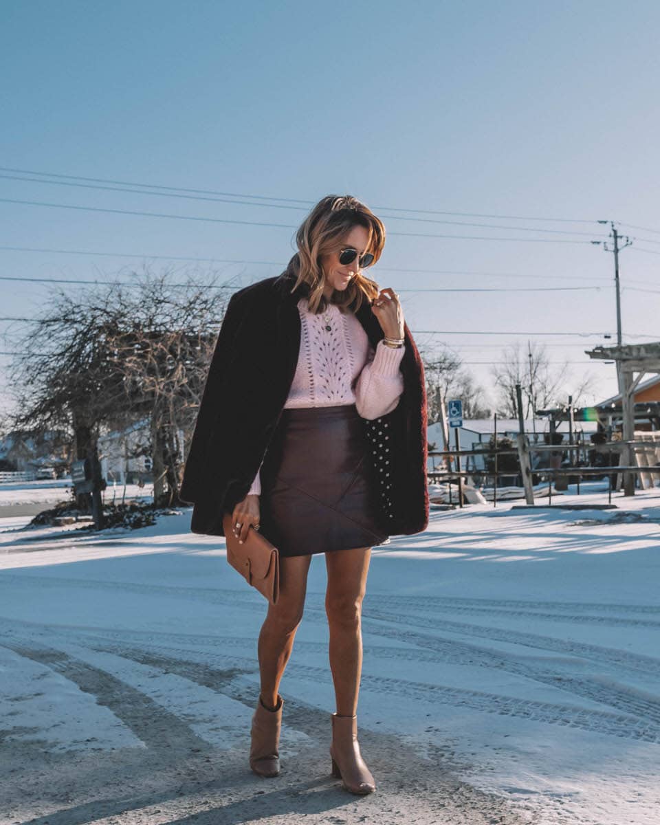 Karina Style Diaries | Pink Sweater | Fur coat | leather skirt | Light pink sweater styled by top Us fashion blogger, Karina Style Diaries: image of a woman wearing an & Other Stories light pink sweater, Goodnight Macaroon mini skirt, a leather clutch, Bernardo booties and ASTR faux fur coat