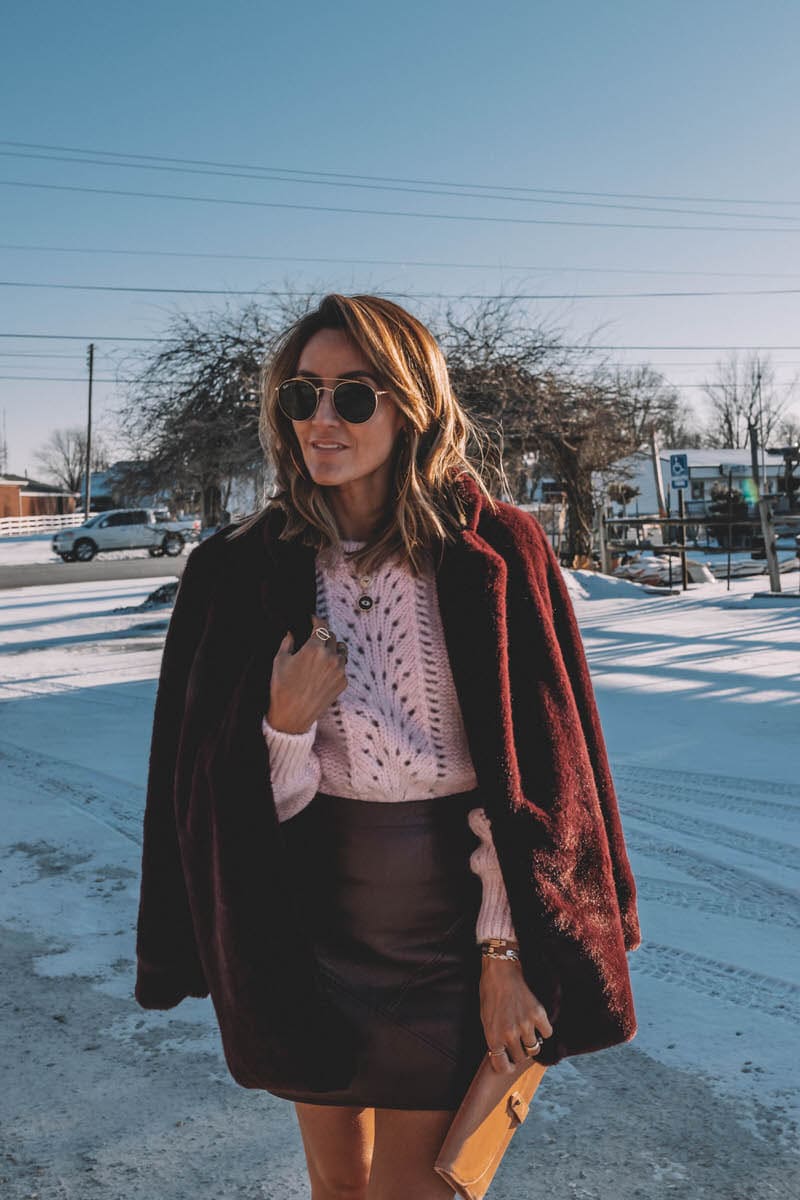 Karina Style Diaries | Pink Sweater | Fur coat | leather skirt | Light pink sweater styled by top Us fashion blogger, Karina Style Diaries: image of a woman wearing an & Other Stories light pink sweater, Goodnight Macaroon mini skirt, a leather clutch, Bernardo booties and ASTR faux fur coat