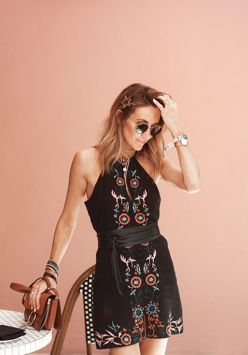 Karina Reske wears Willow and Clay in Palm springs, short halter top embroidered black mini dress, Palm springs hotel
