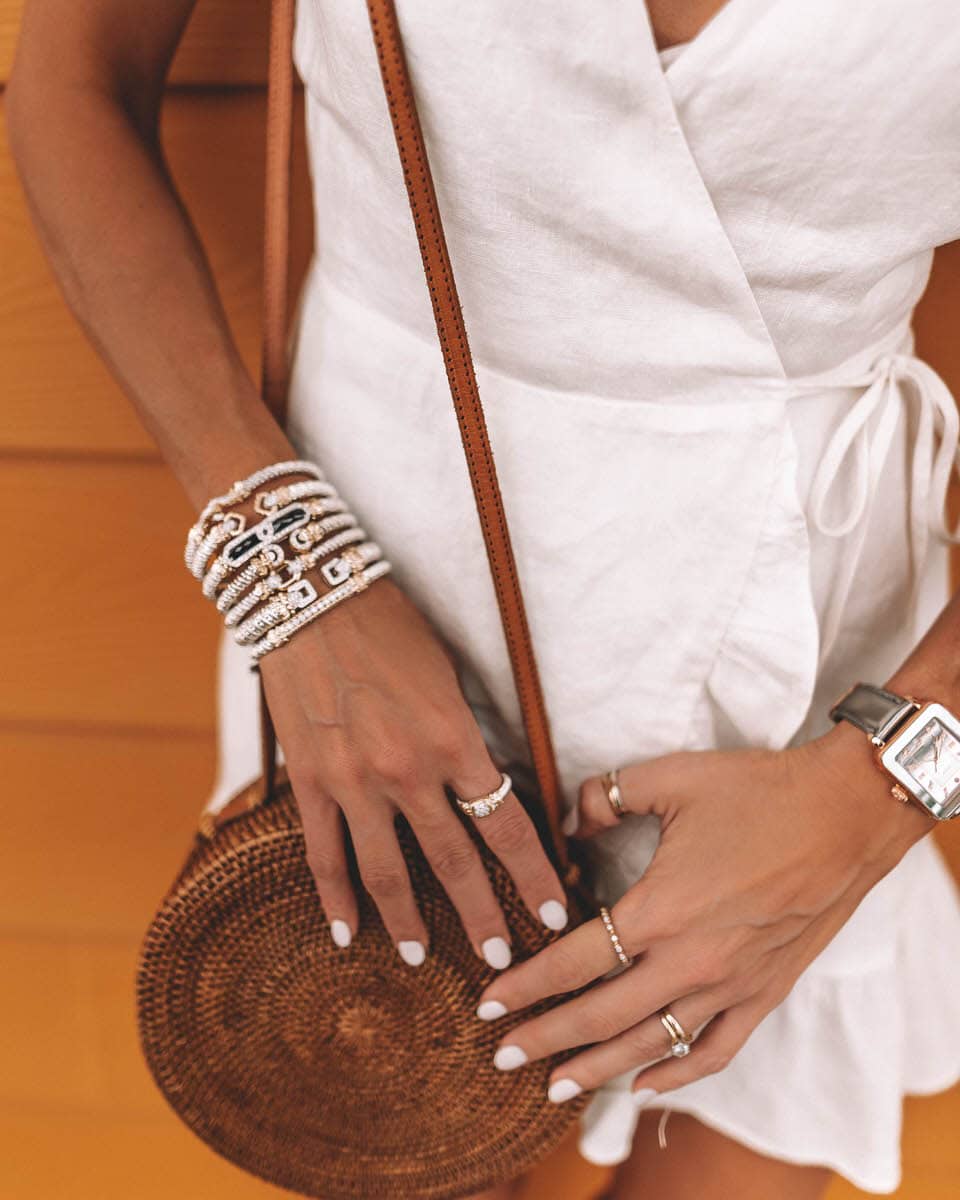 Karina Style Diaries wear VAHAN jewelry, white linen wrap dress | stack bracelets | bold jewelry | how to style bold jewelry | chic simple look