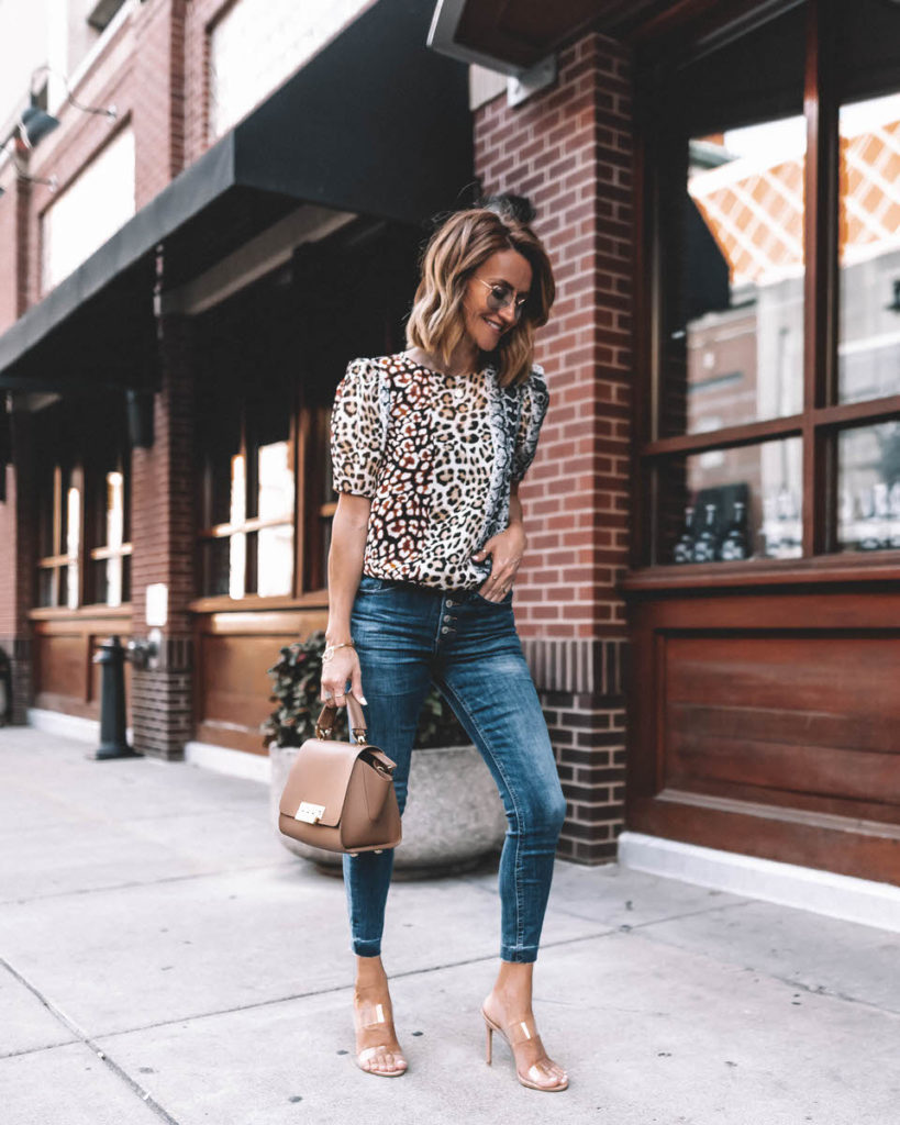 Karina Style Diaries wearing animal print silk blouse puffy sleeve exposed buttom skinny jeans raw hem cropped ray ban marshall