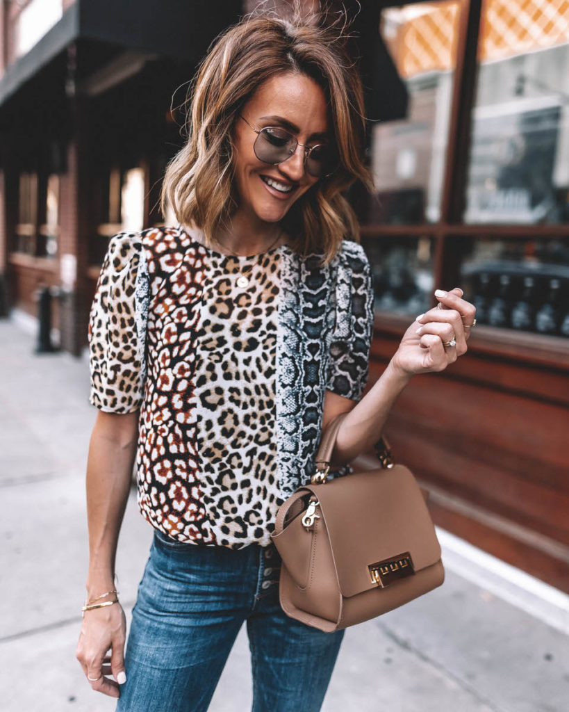 Karina Style Diaries wearing animal print silk blouse puffy sleeve exposed buttom skinny jeans raw hem cropped ray ban marshall