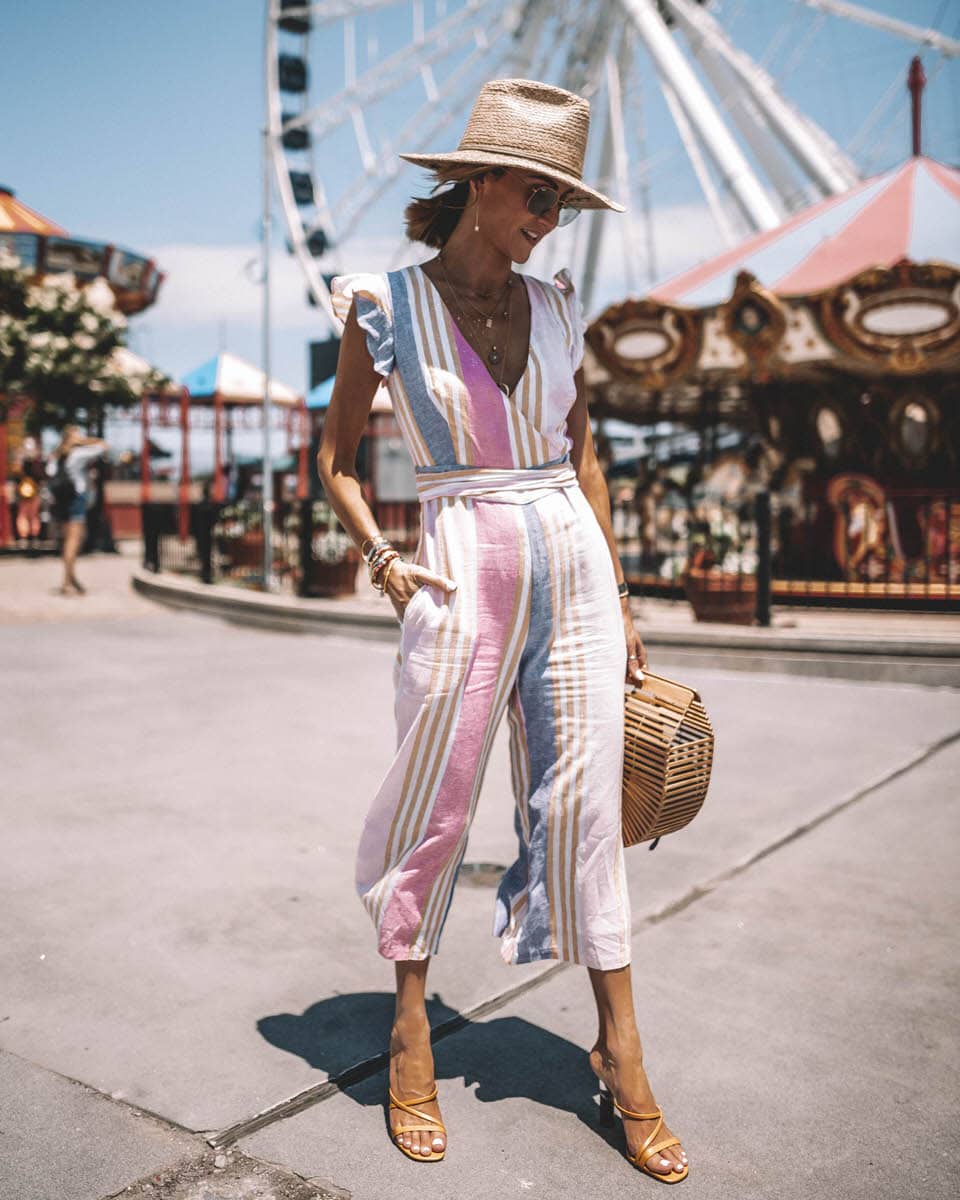 Karina Style Diaries wears striped colorful jumpsuit with ruffle on the sleeves and cropped pant straw hat bamboo bag navy pier chicago