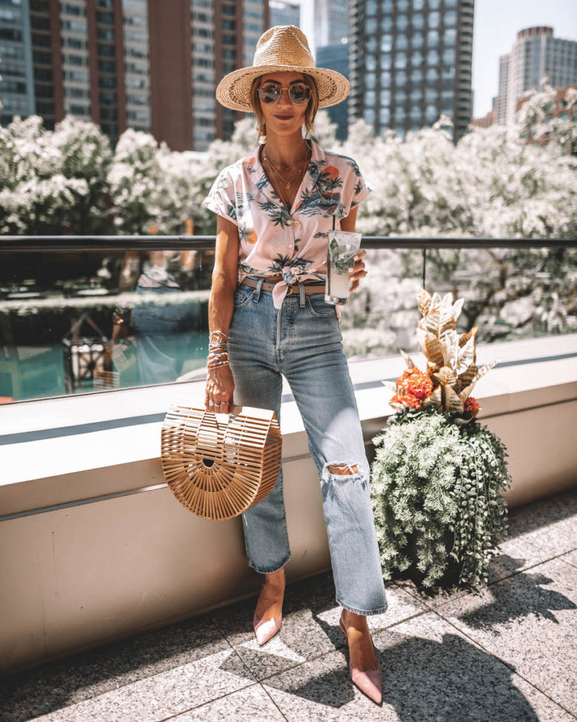 Karina Style Diaries in Chicago wearing tropical print buttom up shirt knotted levi's ribcage jeans bamboo bag pink suede shoes ray ban evolve blue lenses