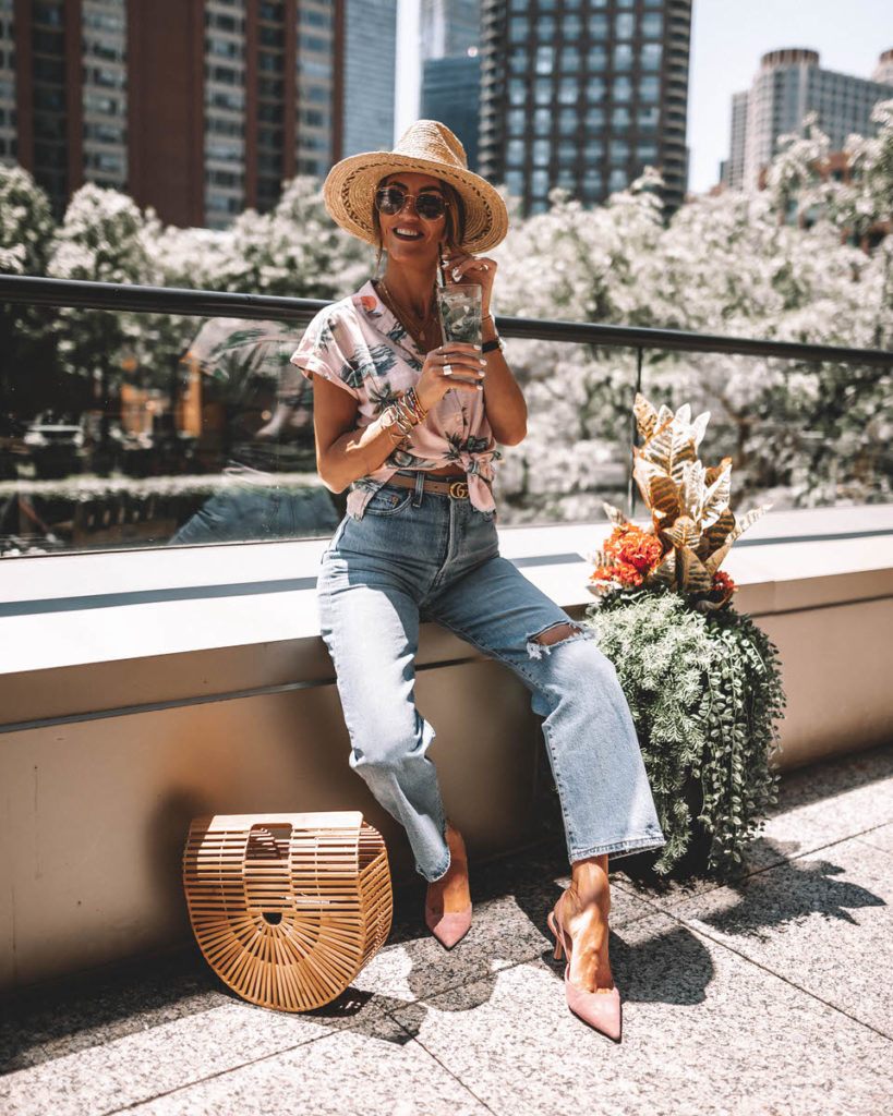 Karina Style Diaries in Chicago wearing tropical print buttom up shirt knotted levi's ribcage jeans bamboo bag pink suede shoes ray ban evolve blue lenses