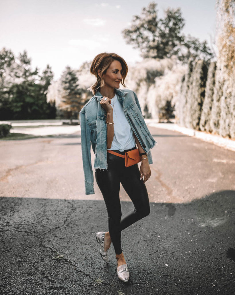Karina Style Diaries wearing spanx faux leather leggings white tee jeans jacket belt bag snakeskin loafers