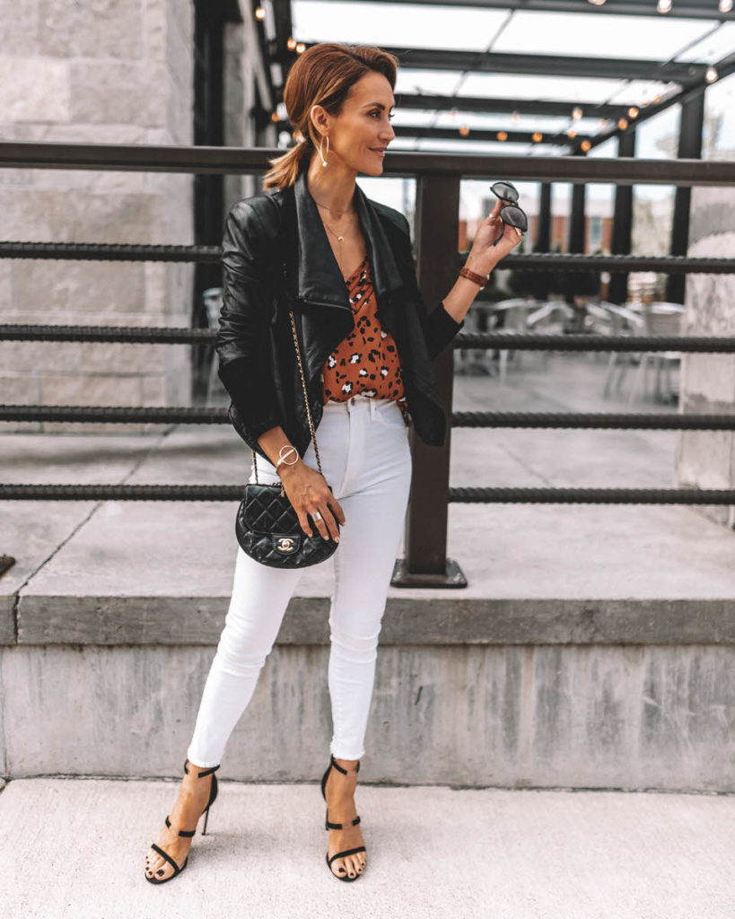 Karina Style Diaries wearing white jeans chic outfit leo print cami black leather jacket chanel bubble crossbody bag tamara mellon reverse sandals