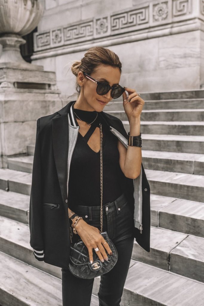 Karina Style Diaries all black outfit cut out top bomber jacket neckline blazer white pumps NYFW