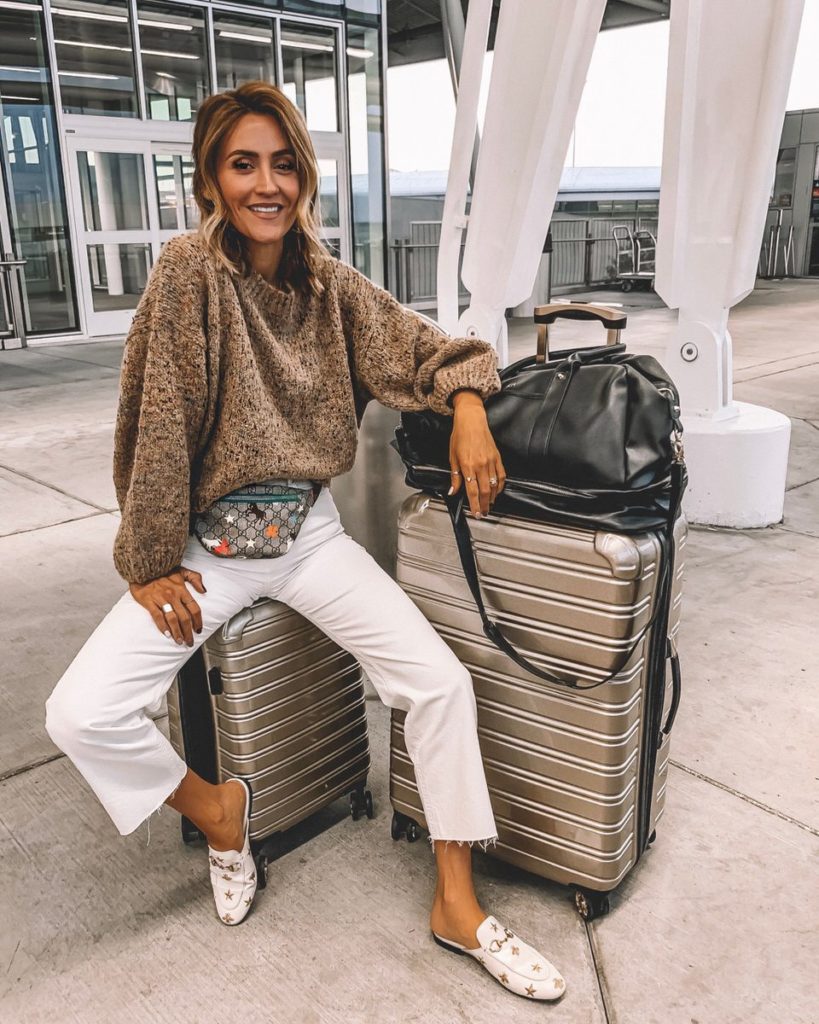 Karina Style Diaries fluffy sweater white wide leg jeans gucci belt bag gucci princetown loafers ifly luggage travel outfit