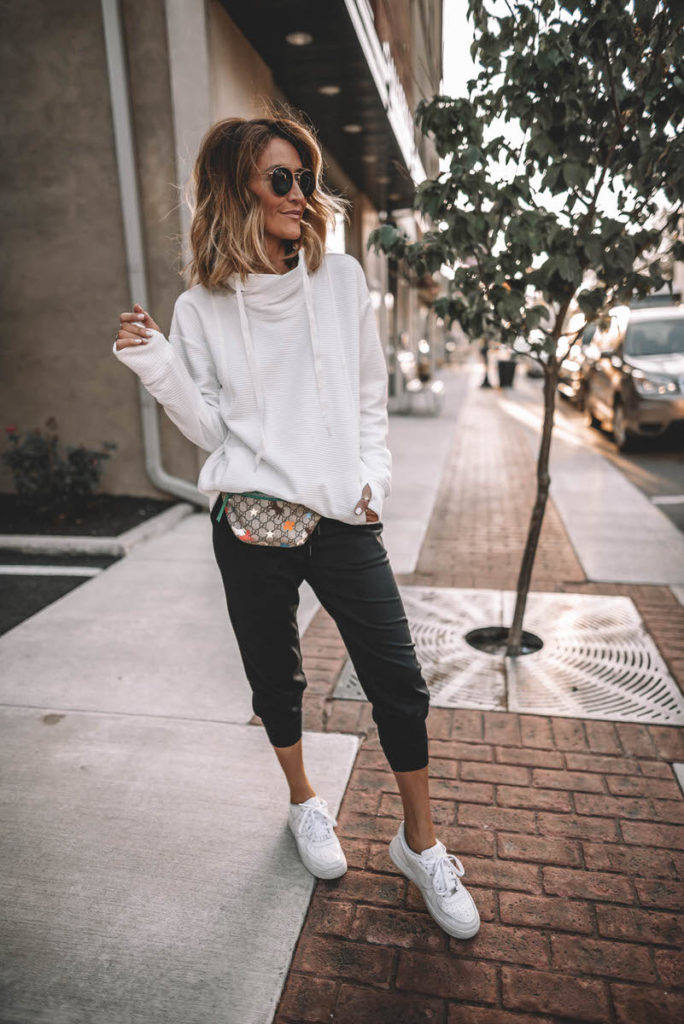 Karina Style Diaries wearing white cowl neck sport pullover black joggers white snekakers casual black & white outfit