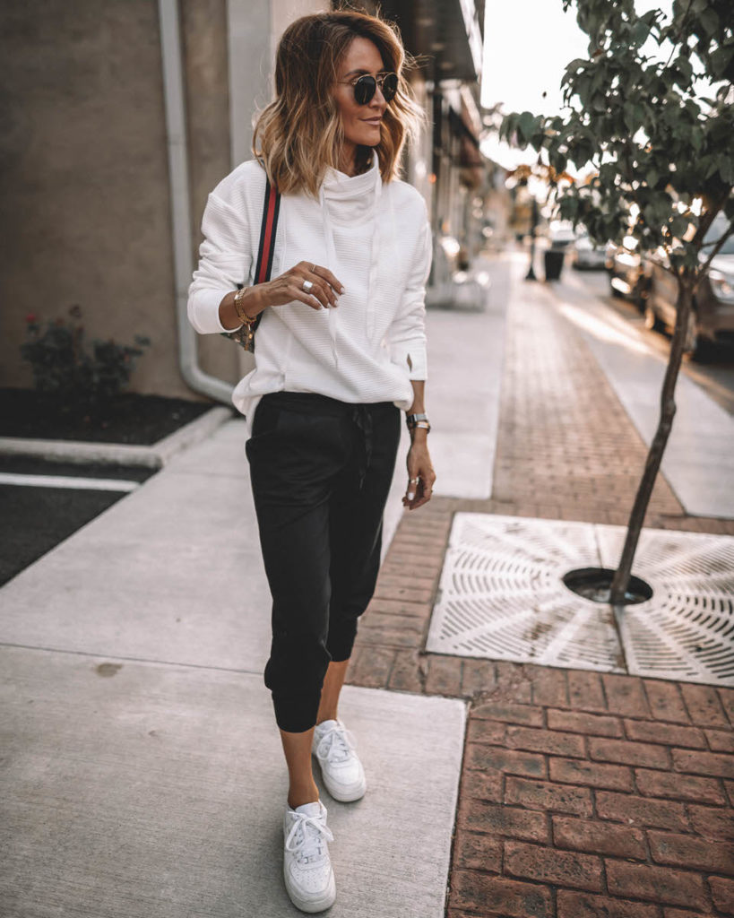 Karina Style Diaries wearing white cowl neck sport pullover black joggers white snekakers casual black & white outfit 