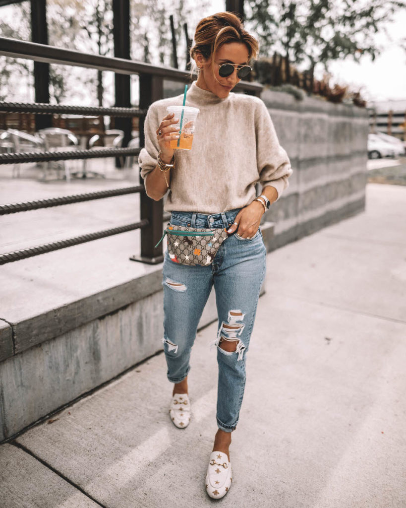 Karina Style Diaries wearing a cream sweater levis 501 gucci belt bag gucci princetown