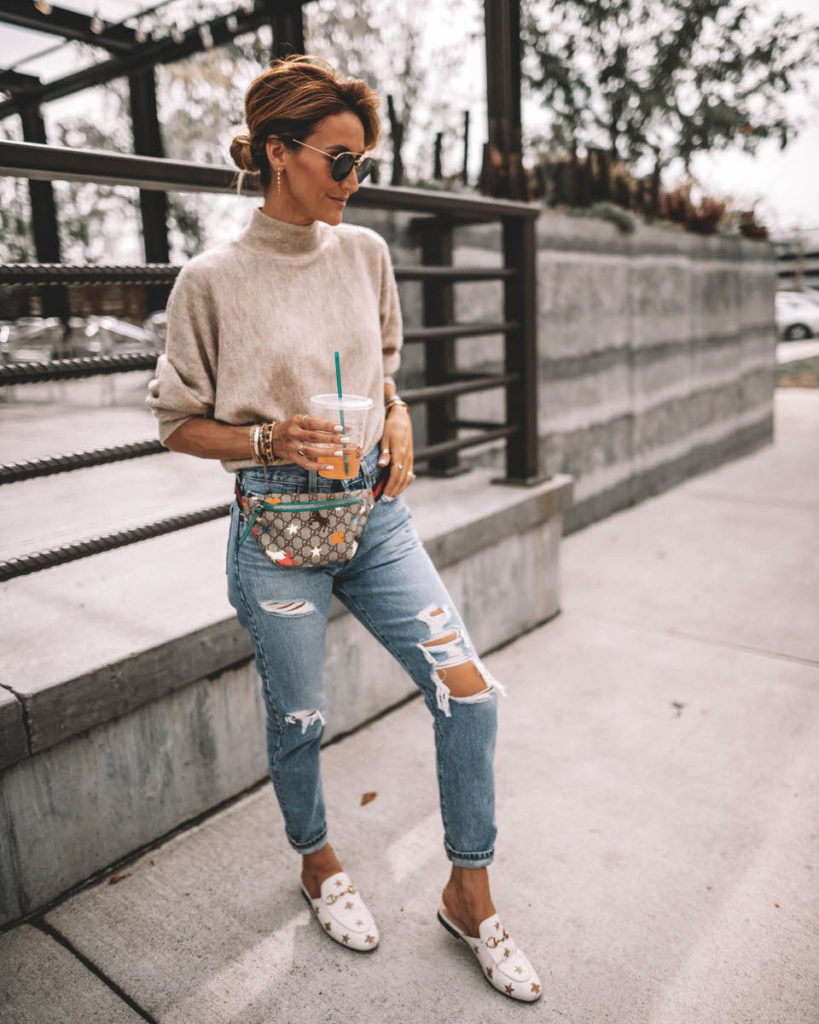 Karina Style Diaries wearing a cream sweater levis 501 gucci belt bag gucci princetown