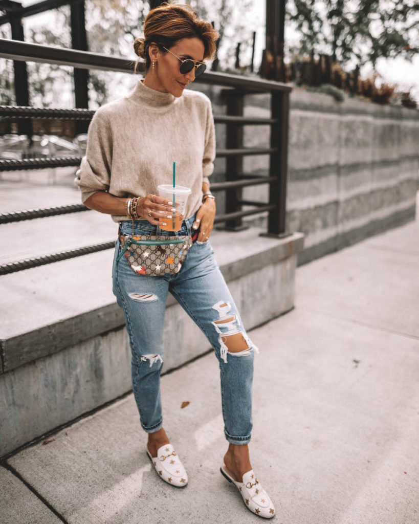Karina Style Diaries wearing a cream sweater levis 501 gucci belt bag gucci princetown