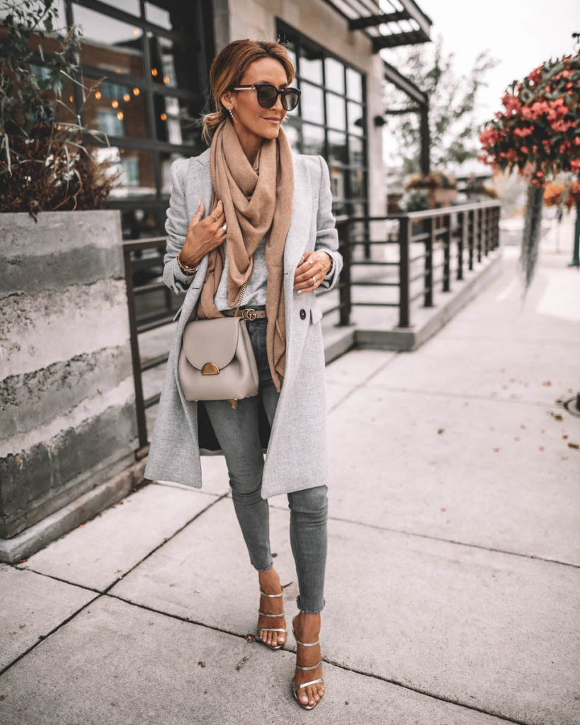 Karina Style Diaries wearing structured grey coat camel cashmere scarf grey skinny jeans gucci belt Polene Numero Un mini grey silver strappy sandals