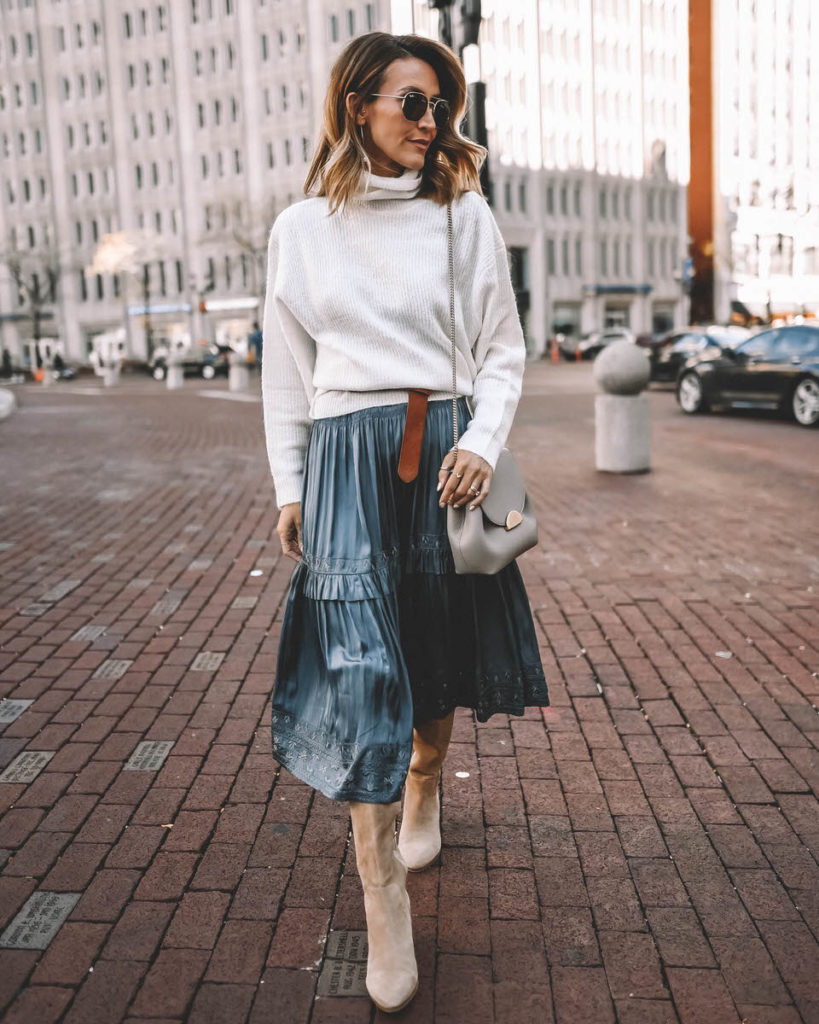 Style Blogger Karina Reske wearing midi Ulla Johnson dress under white slouchy turtleneck sweater suede tall boots