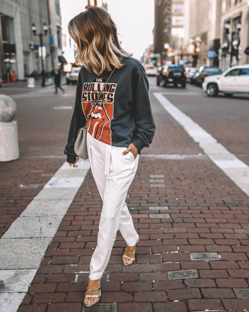 Karina Style Diaries wearing Rolling Stones sweatshirt high waist trousers strappy heeled sandals Polene Numero Un Mini grey outfit