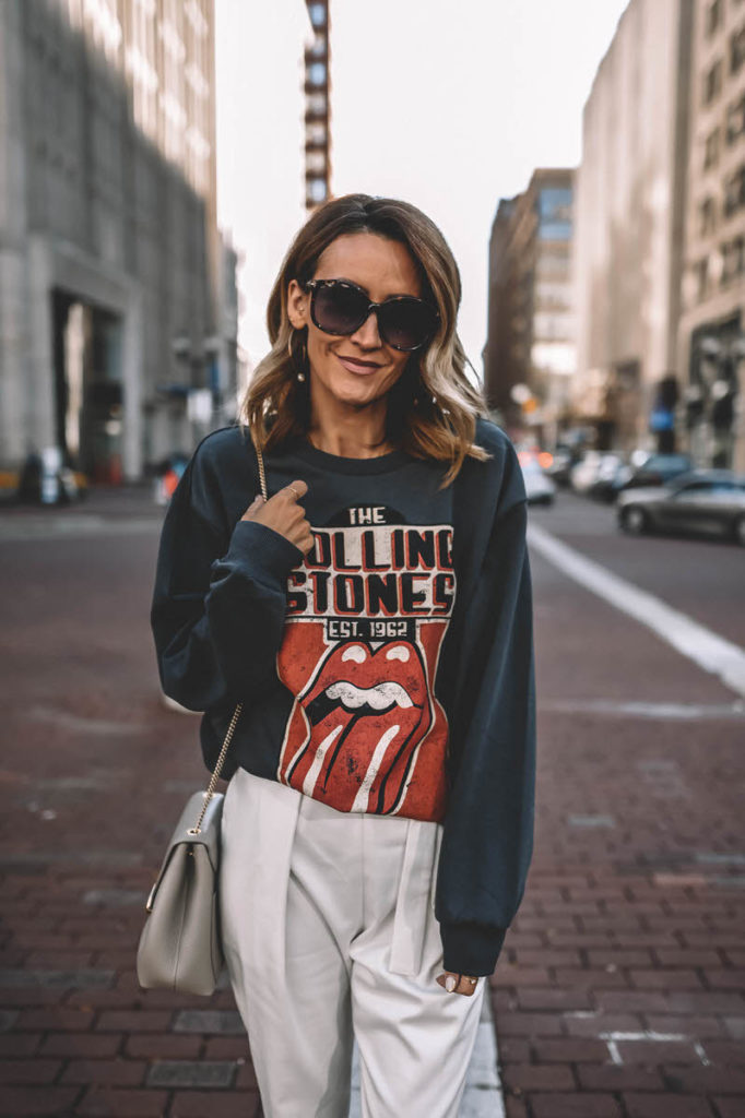 Karina Style Diaries wearing Rolling Stones sweatshirt high waist trousers strappy heeled sandals Polene Numero Un Mini grey outfit
