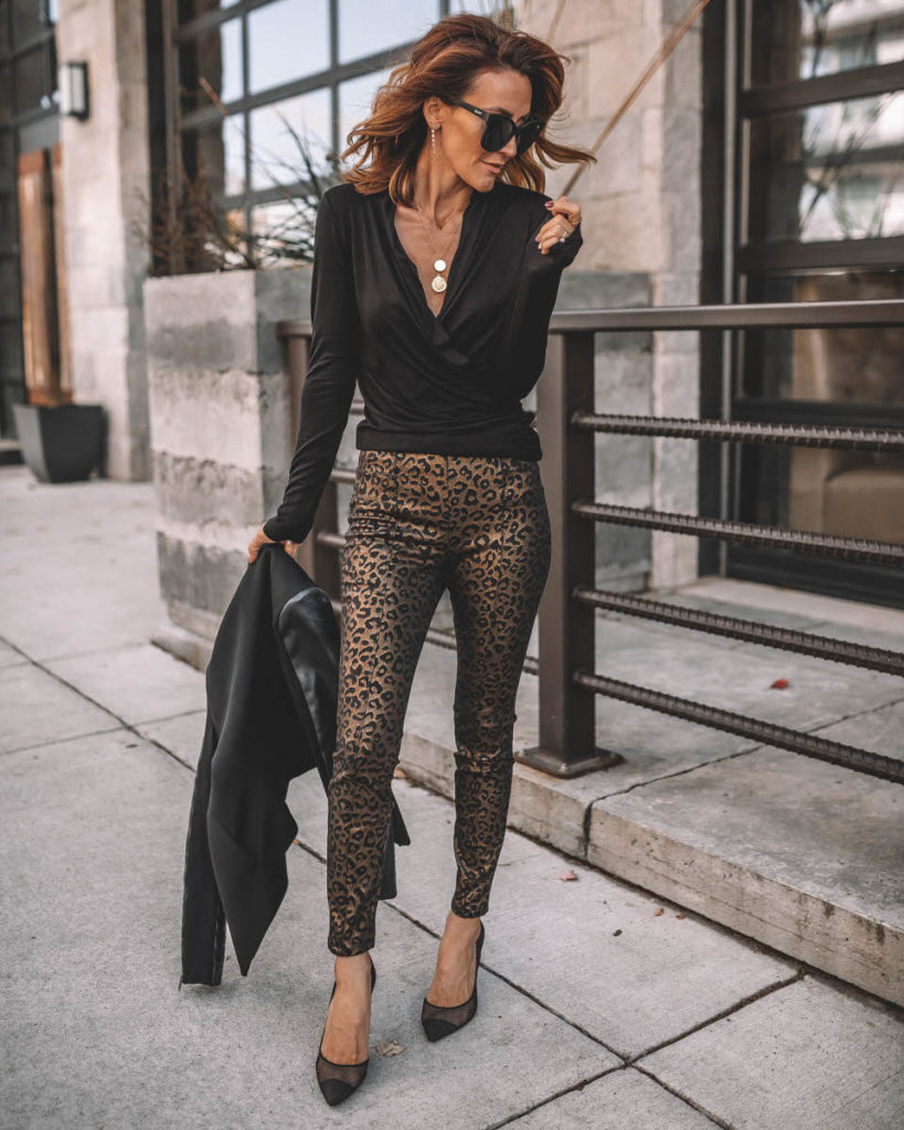 Karina Style Diaries wearing black long sleeve top gold leopard print pants work holiday outfit