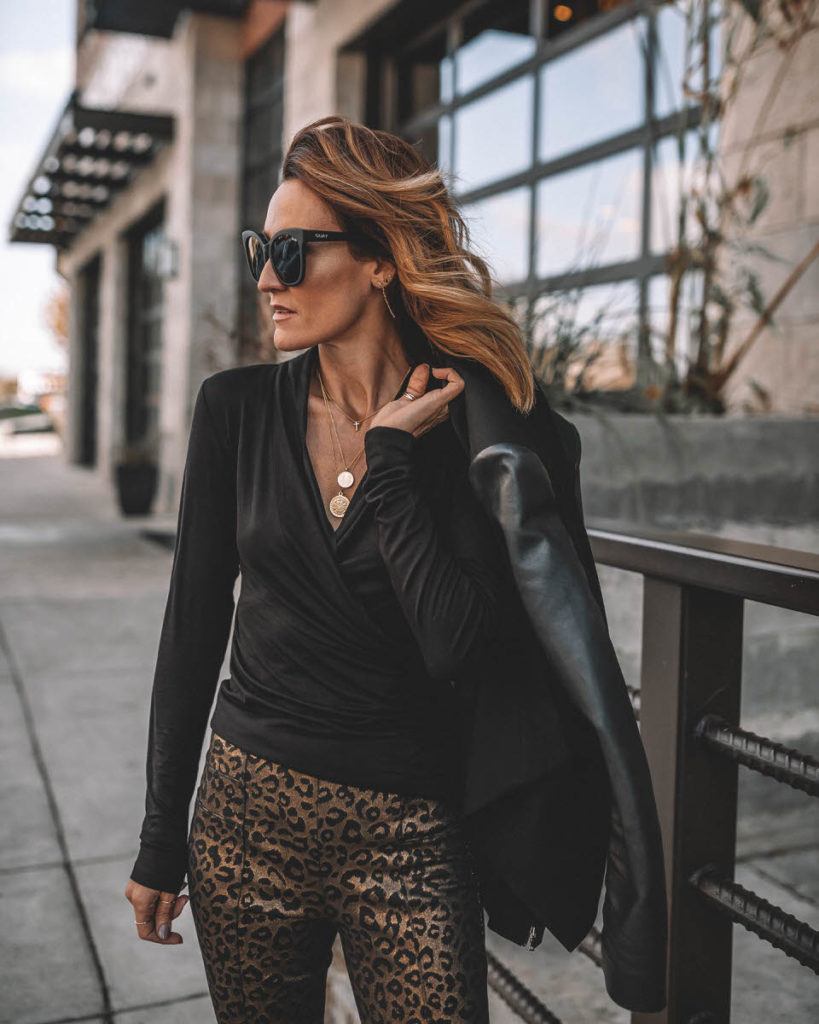 Karina Style Diaries wearing black long sleeve top gold leopard print pants work holiday outfit