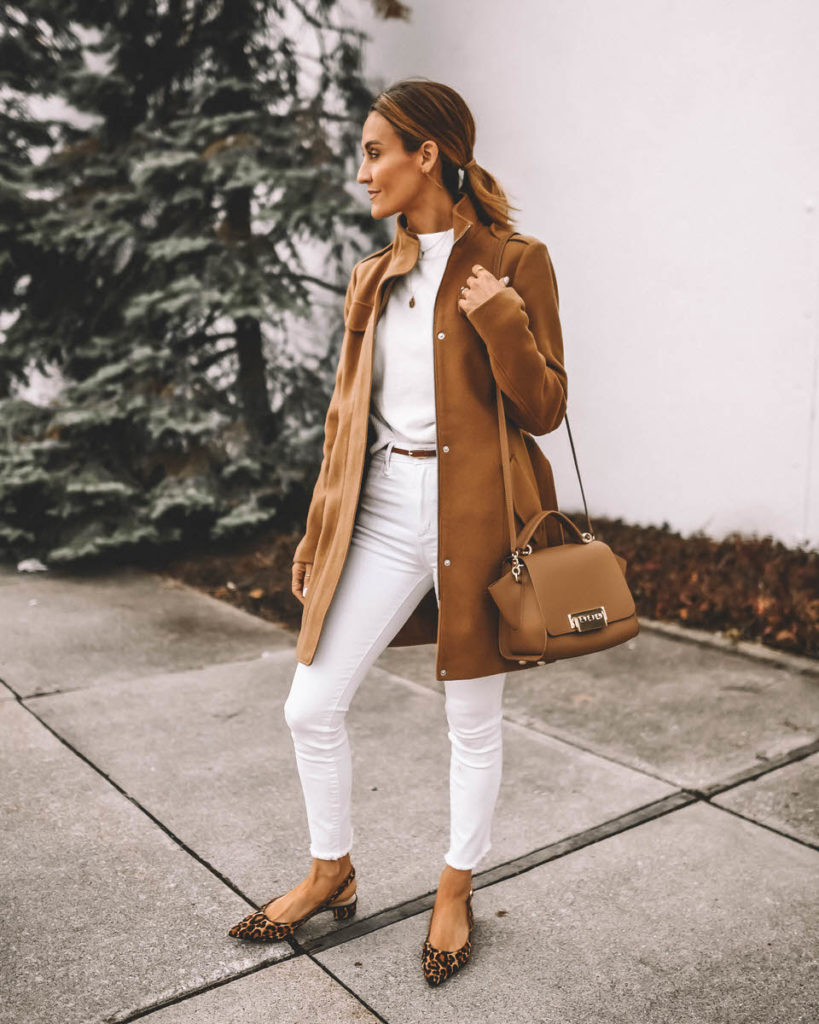 Style Blogger Karina Reske wearing camel coat winter white jeans white sweater