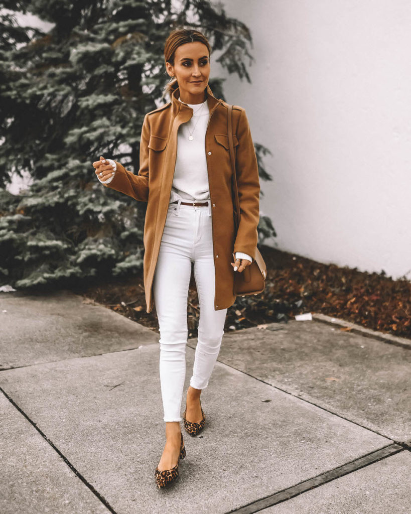 Style Blogger Karina Reske wearing camel coat winter white jeans white sweater