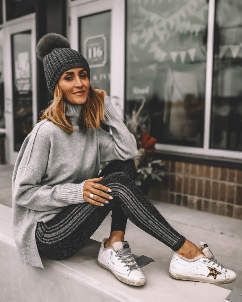 Karina Style Diaries wearing sparkly black and silver leggings grey sweater pompom beanie