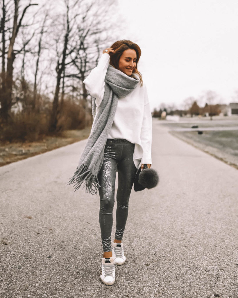 Karina Style Diaries wearing foil silver leggings oversized white sweater blanket scarf pompom beanie cozy style