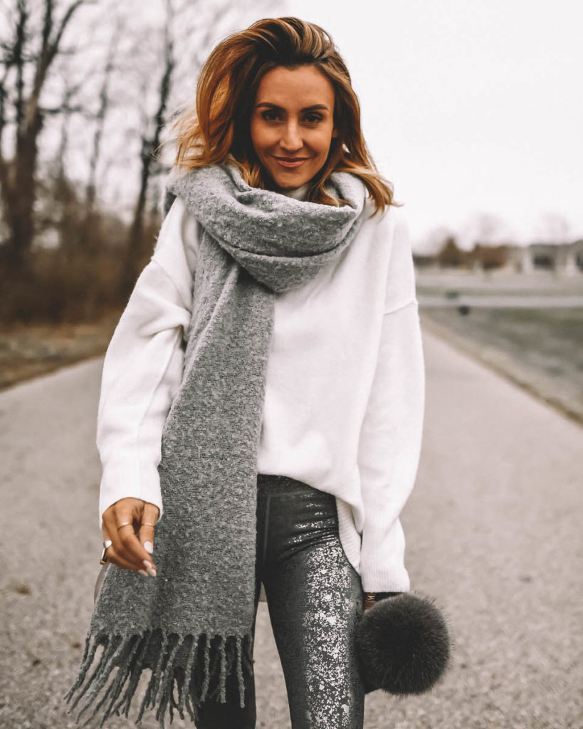 Karina Style Diaries wearing foil silver leggings oversized white sweater blanket scarf pompom beanie cozy style
