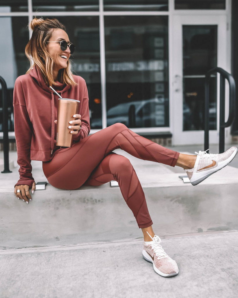Lifestyle Blogger Karina Reske wearing Athletic set Sweaty Betty rust leggings and hoodie