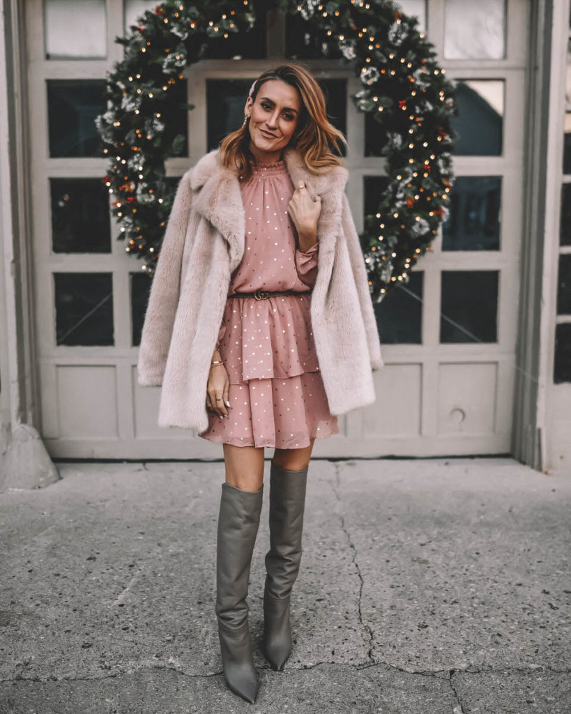 Style Blogger Karina Reske wearing polka dot ruffle blush mini dress faux fur nude coat tall slouchy grey boots