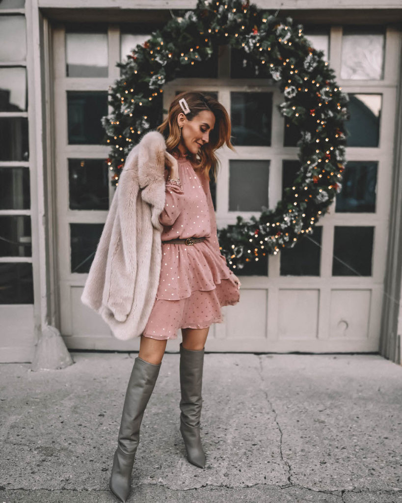 Style Blogger Karina Reske wearing polka dot ruffle blush mini dress faux fur nude coat tall slouchy grey boots