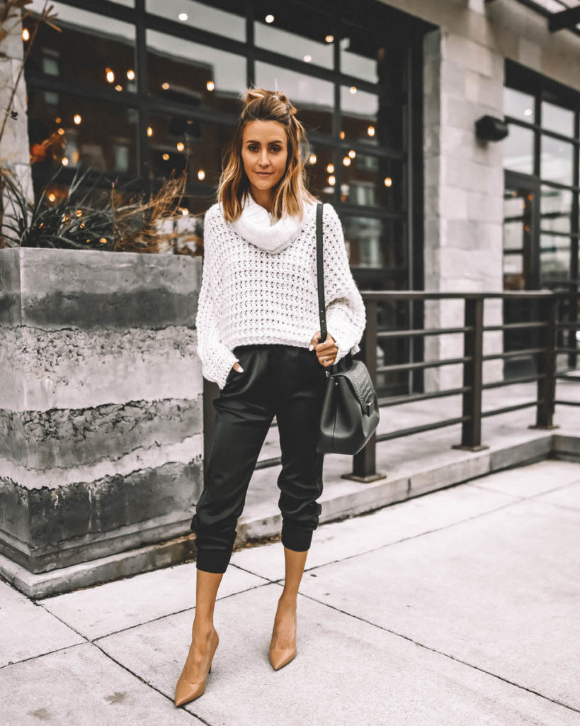 Karina Style Diaries wearing white cowl neck sweater black satin joggers nude pumps