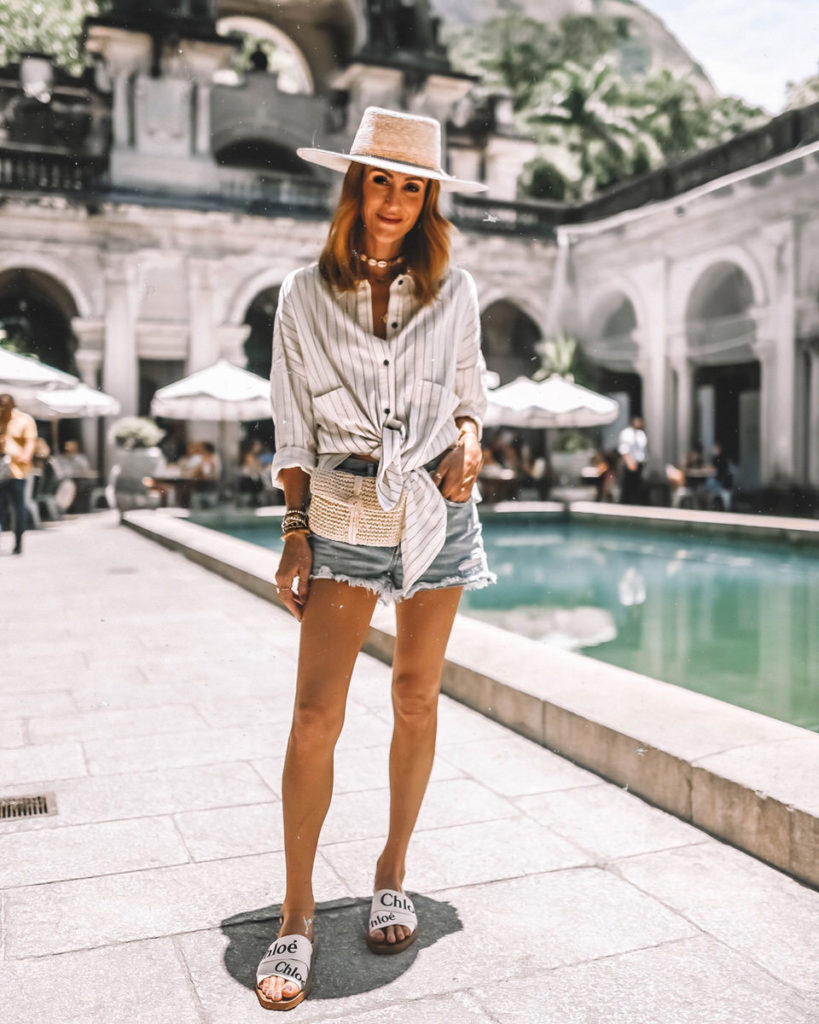 Karina Style Diaries at Parque Lage wearing agolde shorts stripped shirt straw hat chloe sandals