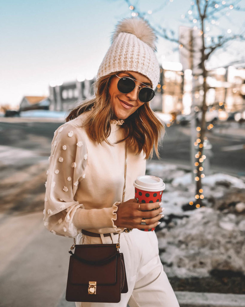 Fashion blogger Karina Reske wearing monochromatic cream outfit winter style