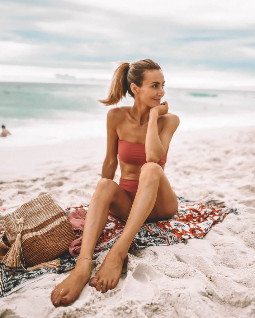 Travel Blogger Karina Reske wearing two piece bandeau high waist mauve bikini