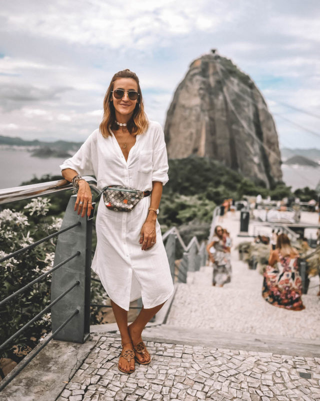 Karina Style Diaires wearing white long tunic Gicci belt bag Sugarloaf mountain Rio