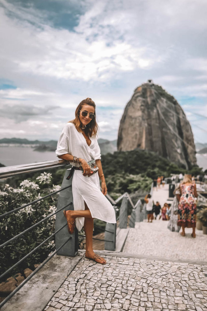 Karina Style Diaires wearing white long tunic Gicci belt bag Sugarloaf mountain Rio 