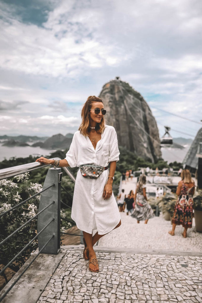 Karina Style Diaires wearing white long tunic Gicci belt bag Sugarloaf mountain Rio
