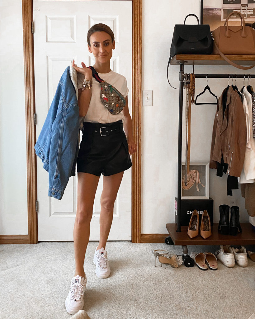 white tee gucci belt bag jeans jacket fila disruptor black leather shorts outfit