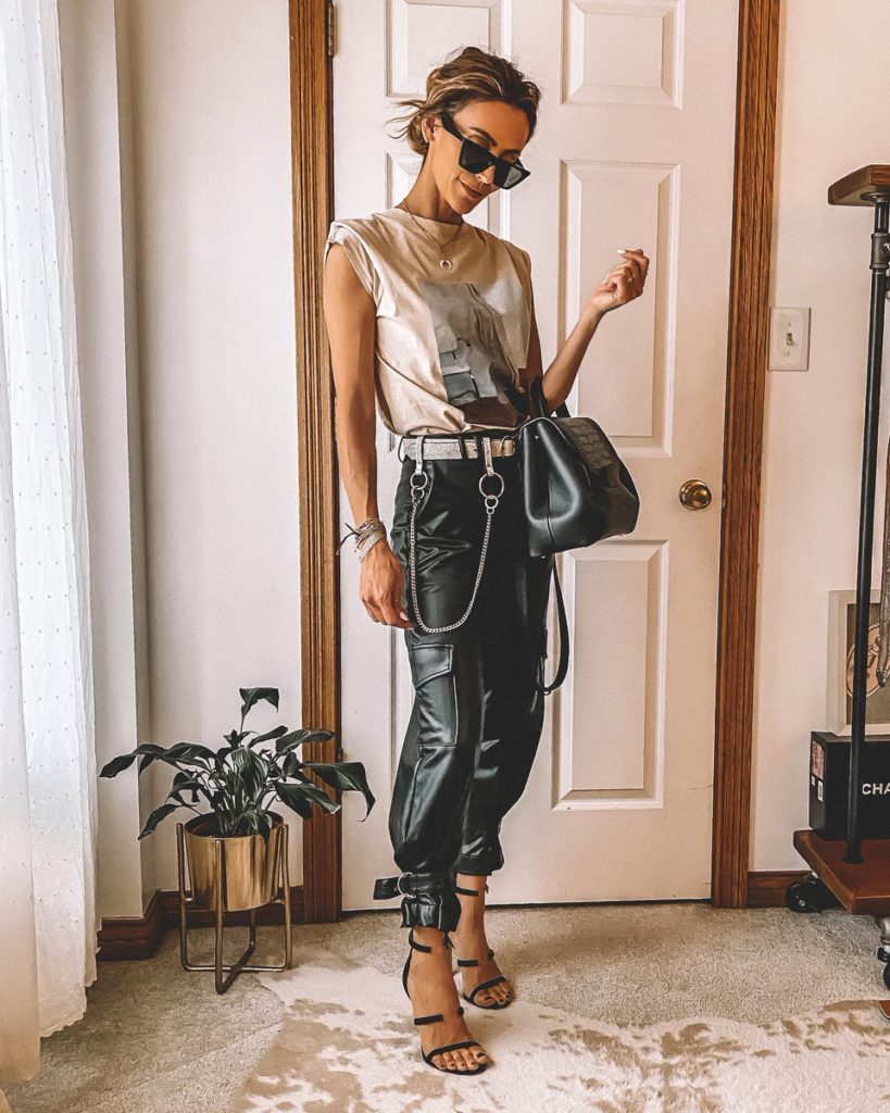 Karina Style diaries wearing vegan leather joggers chain belt beige graphic tee Tamara Mellon sandals edgy style