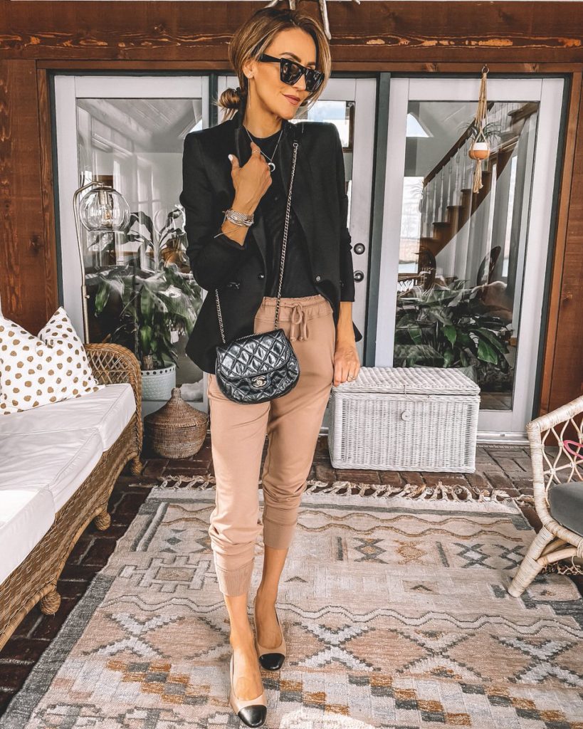 Karina Style Diaries wearing cozy joggers black tee fitted blazer chanel dupe cap toe slingbacks chanel bubble bag Celine sunglasses casual chic outfit