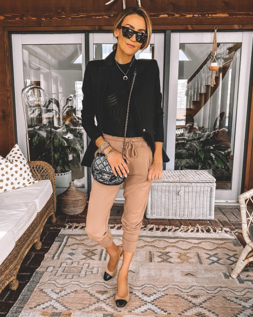 Karina Style Diaries wearing cozy joggers black tee fitted blazer chanel dupe cap toe slingbacks chanel bubble bag Celine sunglasses casual chic outfit