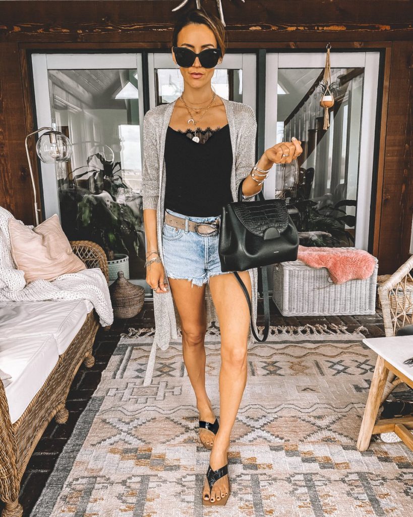 Agolde shorts outfit styled with black lace bodysuit Gucci Dionysius belt Polene black bag
