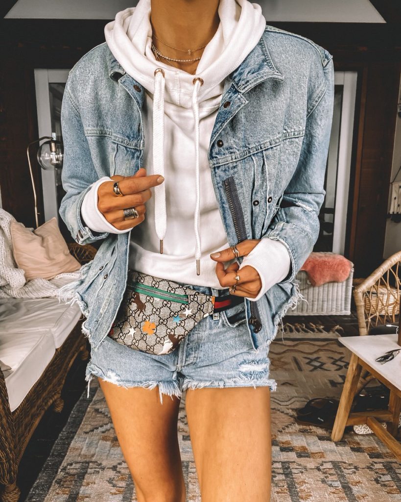 Denim on denim outfit jeans shorts jeans jacket white cropped hoodie gucci belt bag