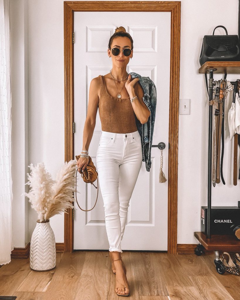 Tan one piece bathing suit styled as a bodysuit white jeans neutral outfit